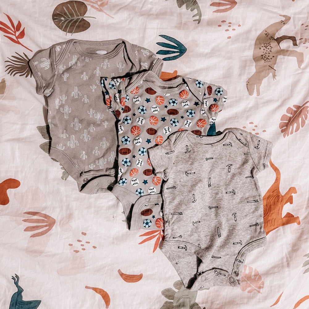 Assorted newborn onesies